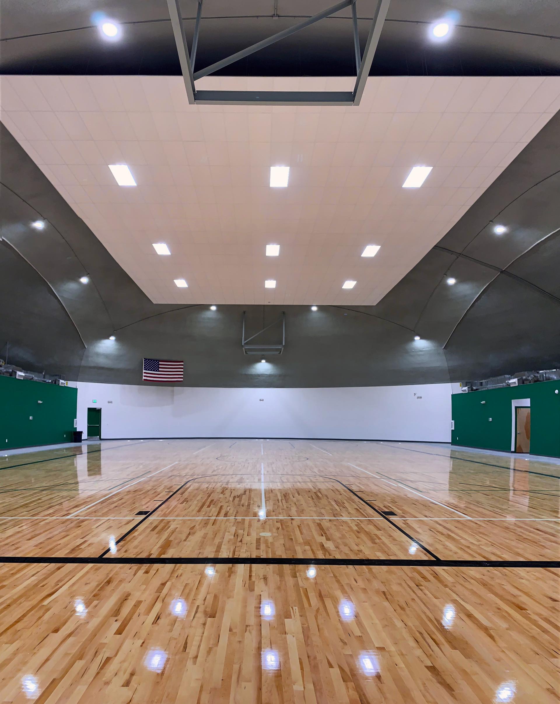 Full size basketball court with six-foot-wide walking track.