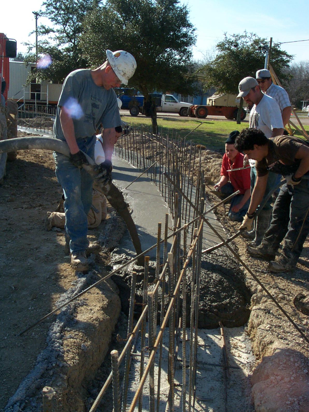 Pouring the concrete footing.