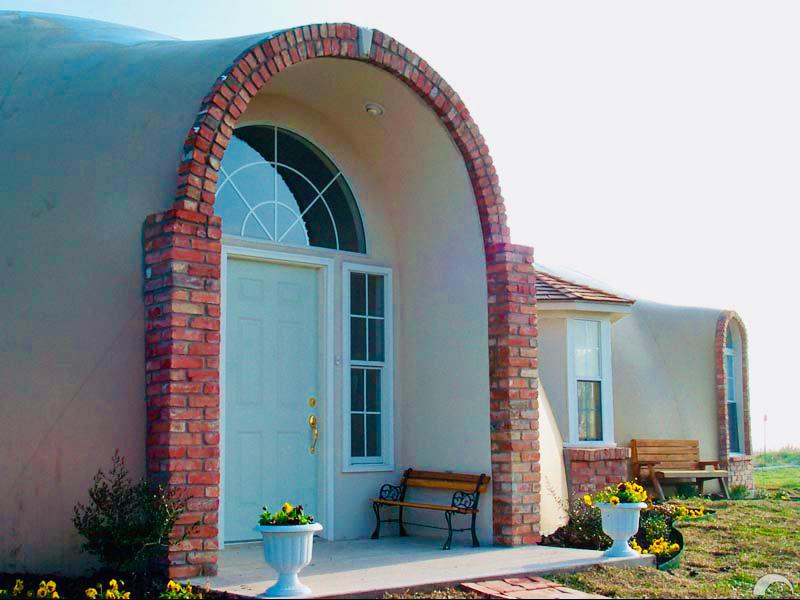 A beautiful arched entrance to a Monolithic Dome Home.