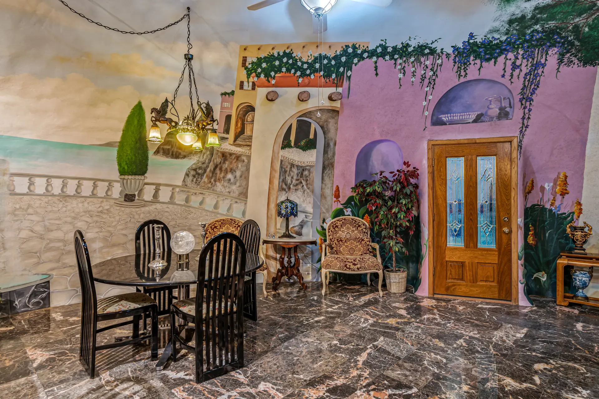 The dining area painted with a seaside patio view.