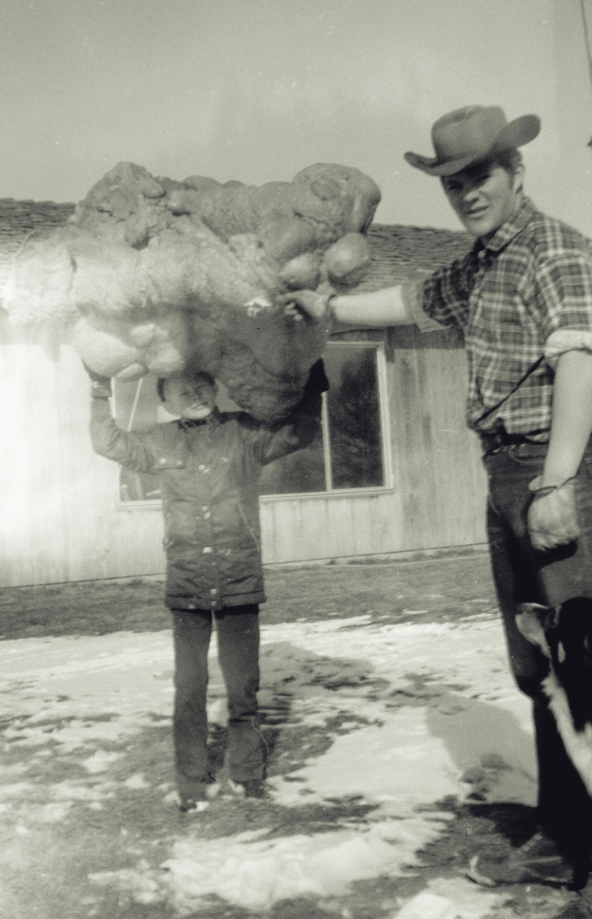 Boy holding a polyurethane "boulder"
