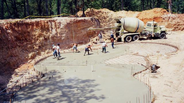 Pouring concrete foundation for underground home