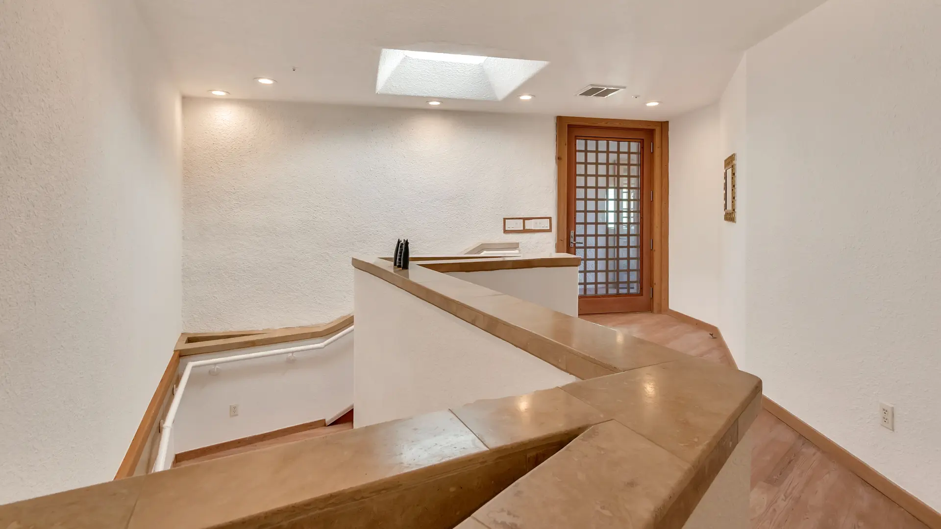 Triangular-Shaped Alcoves in Stairway Banisters.