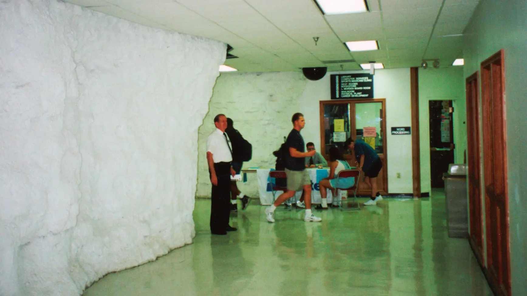 Underground hallway leading to classrooms, library, and offices.