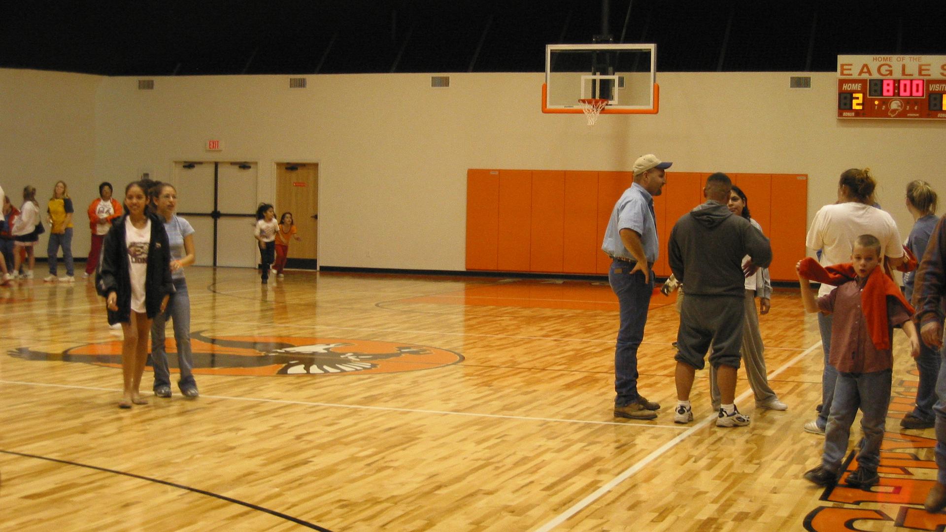 Residents from the surrounding area tour the newly completed gymnasium.