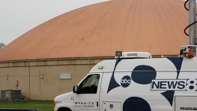 WFAA news 8 van parked outside Monolithic Dome gym.