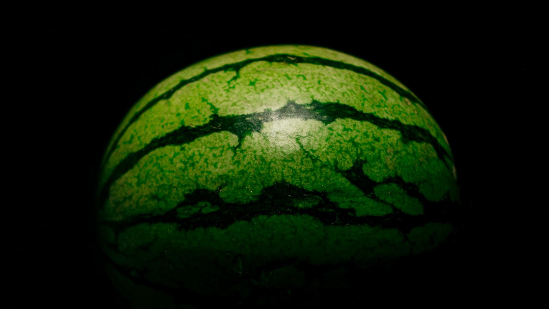 A watermelon on its side to show the basics of horizontal ellipsoids.