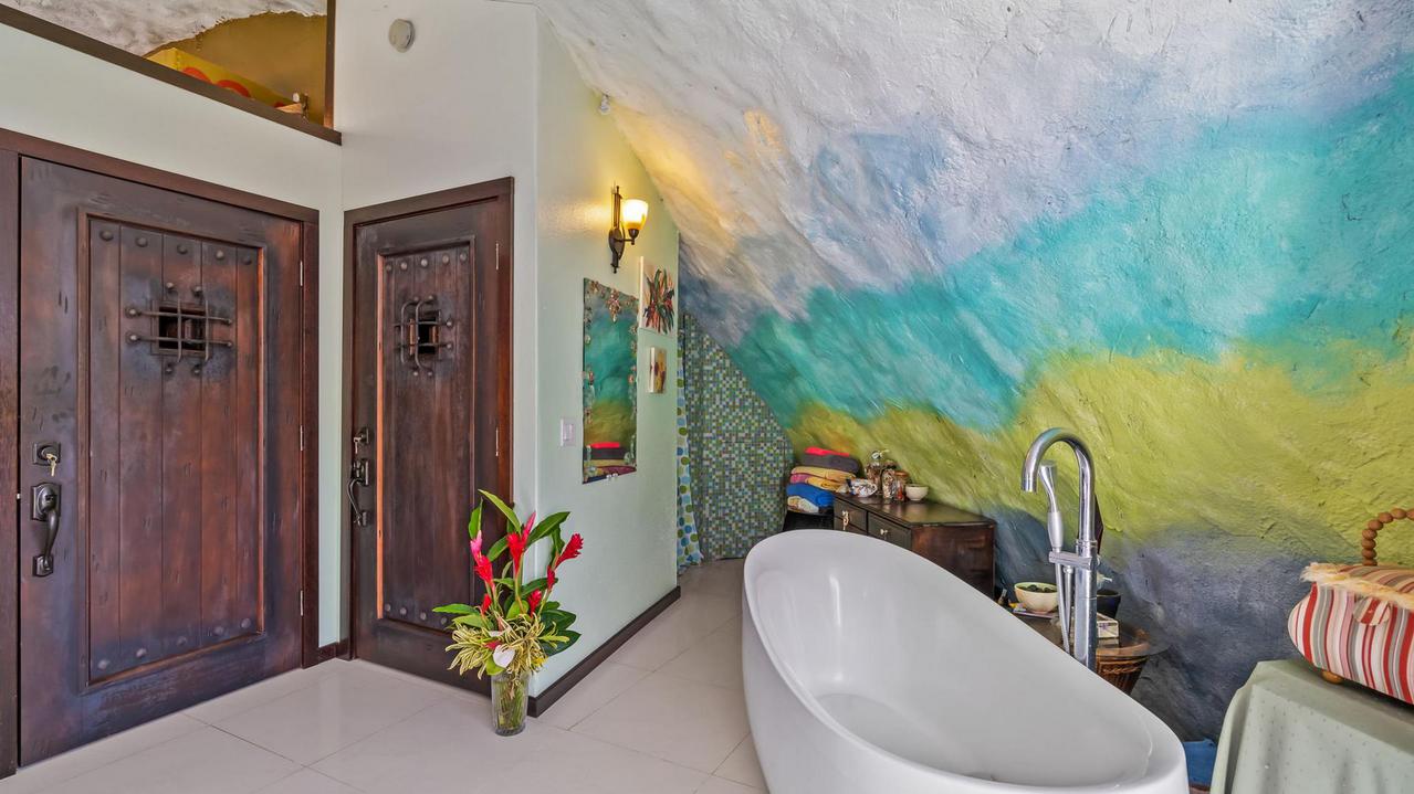 Painted walls, large heavy doors, a stand-alone tub in the main bedroom.