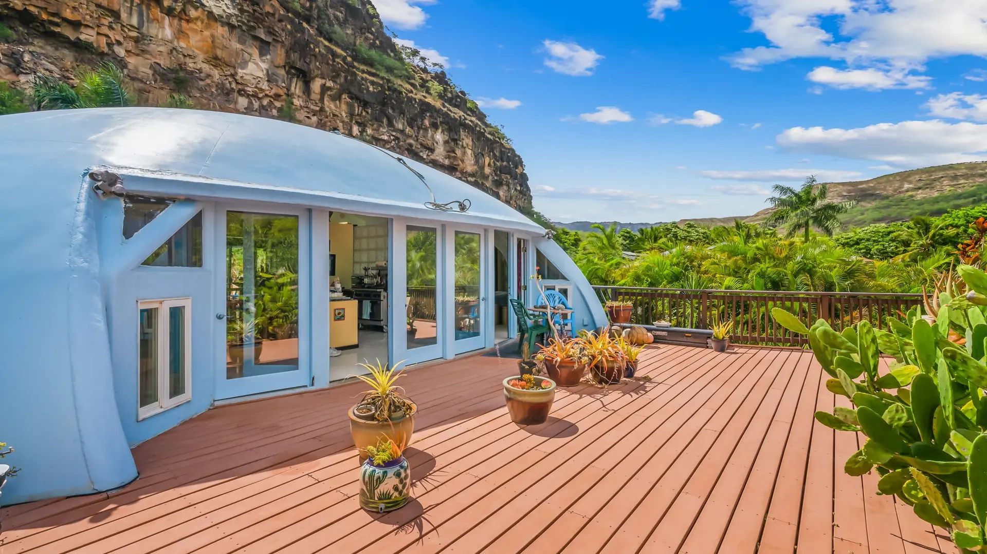 The raised deck or lanai looks over the tree tops.