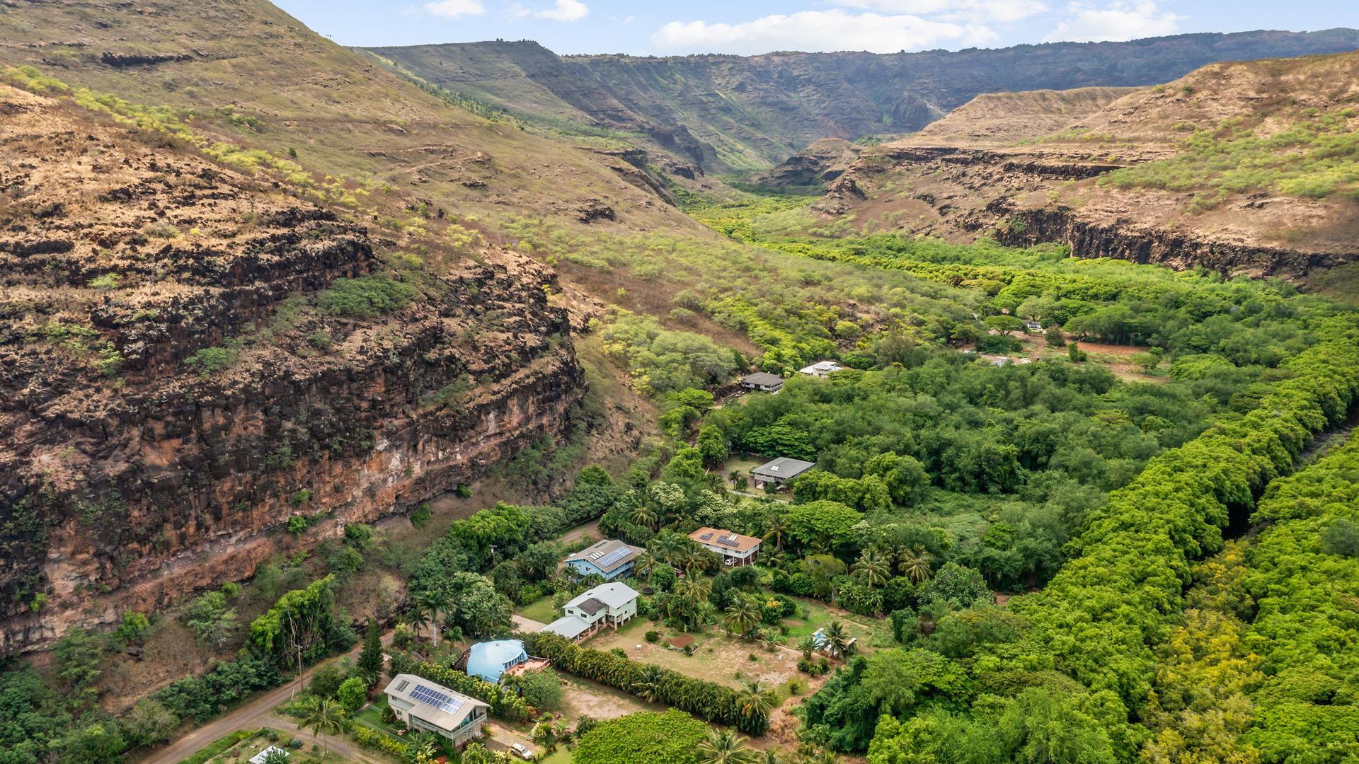 A breathtaking aerial view looking upriver into the Waimea Valley.