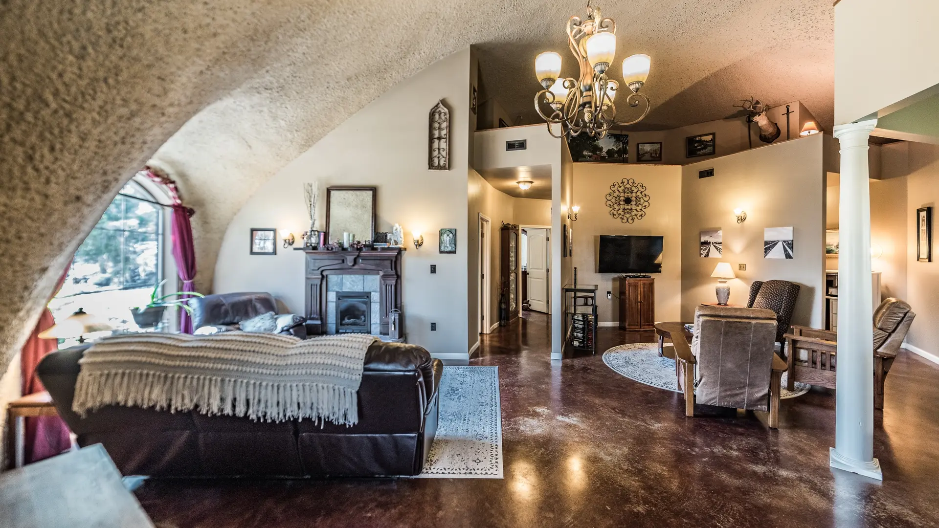 Stained concrete floor and rough dome walls.