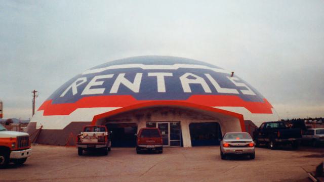 Rentals sign embedded in metal cladding on the dome.