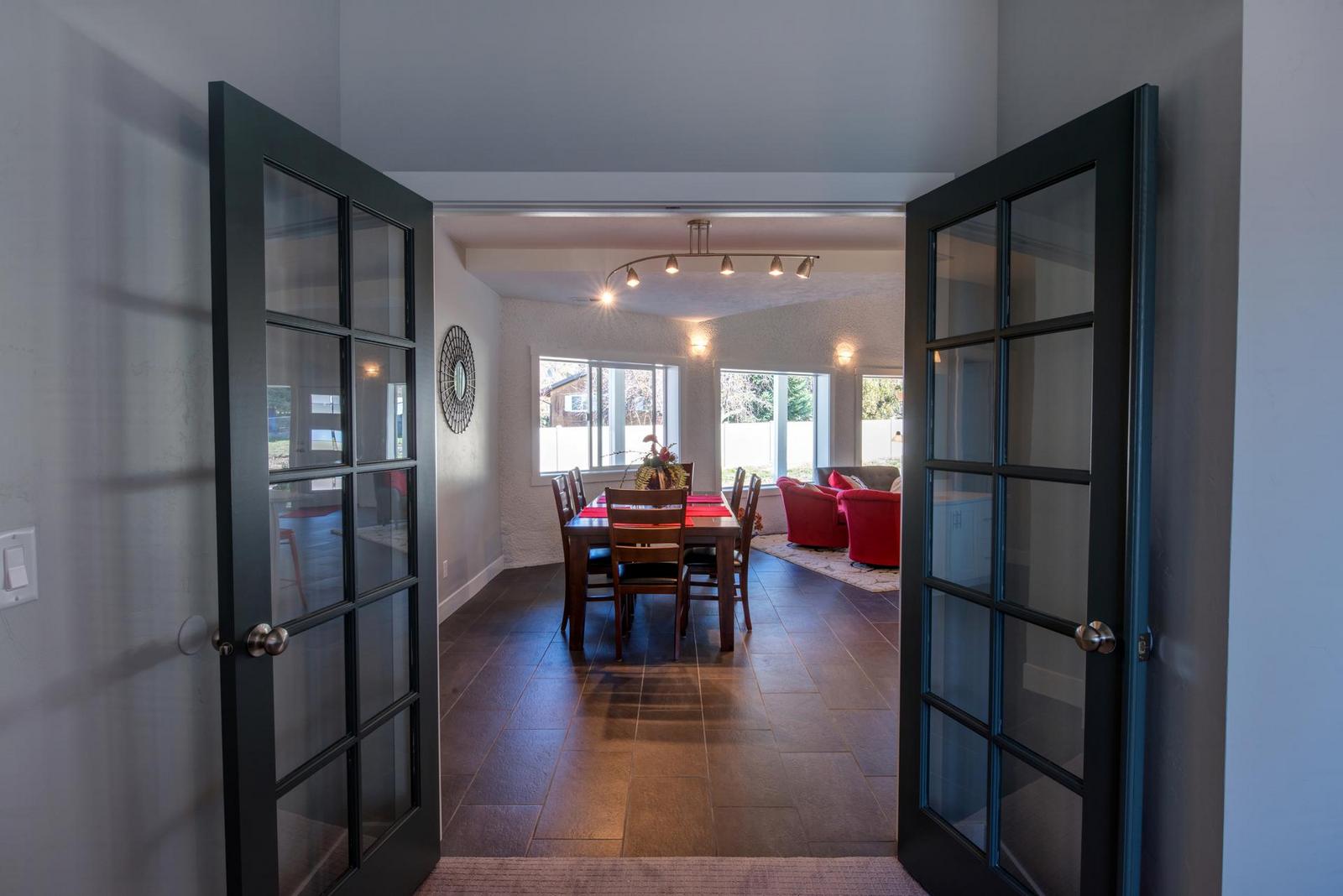 Gray French doors lead to the great room.