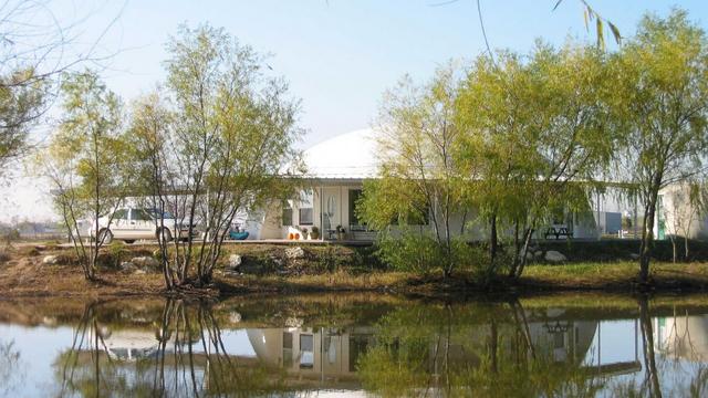 View of the Callisto Monolithic Dome Home from across the pond.