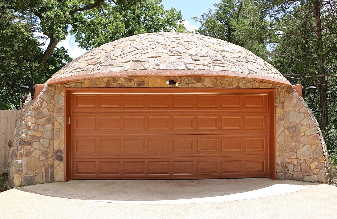 The stone-covered Monolithic Dome garage at the Whiteacre residence.