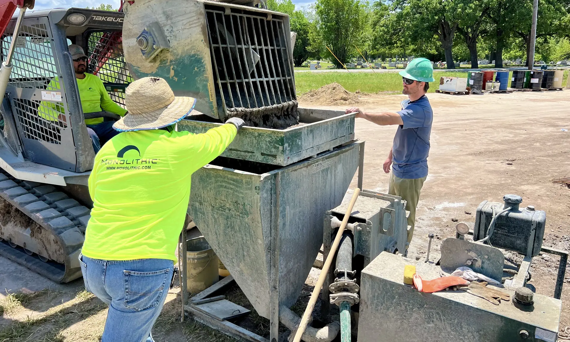 Student and instructors loading the concrete pump.
