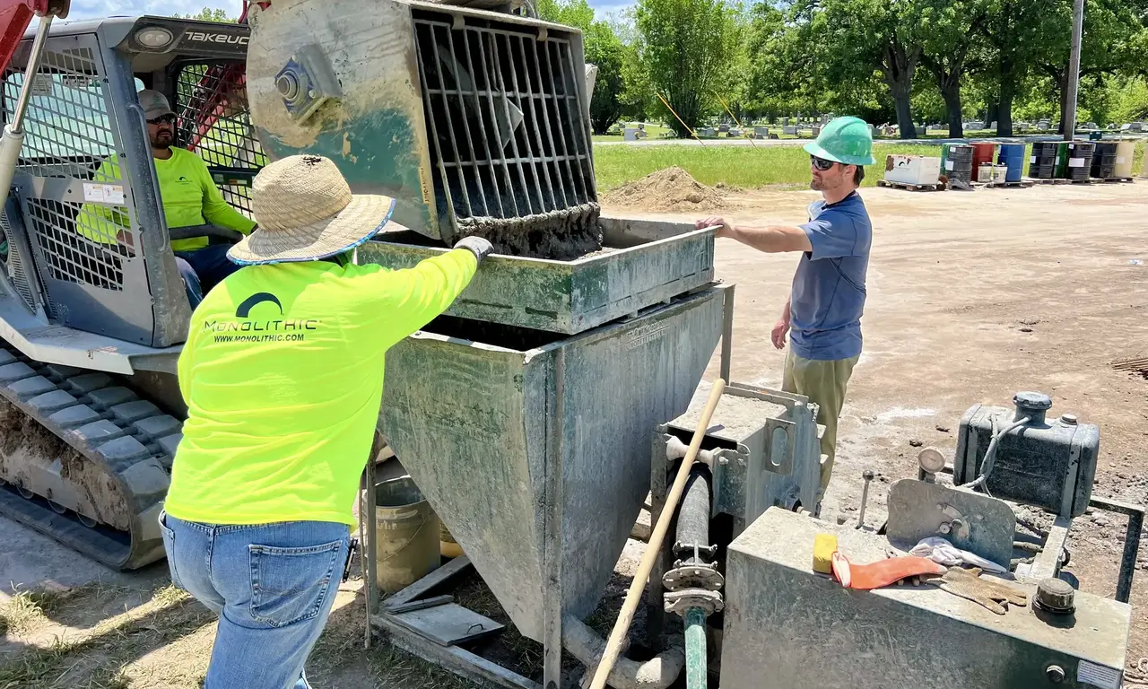 Student and instructors loading the concrete pump. Student and instructors loading the concrete pump.