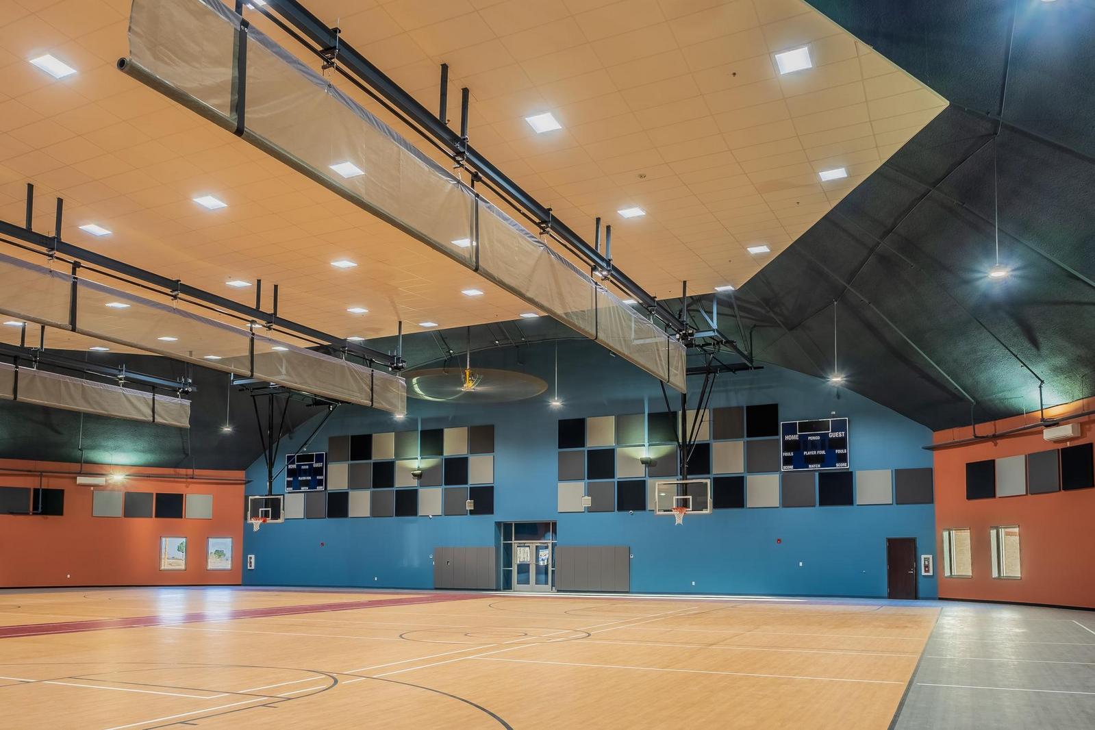 Basketball courts in gymnasium dome.