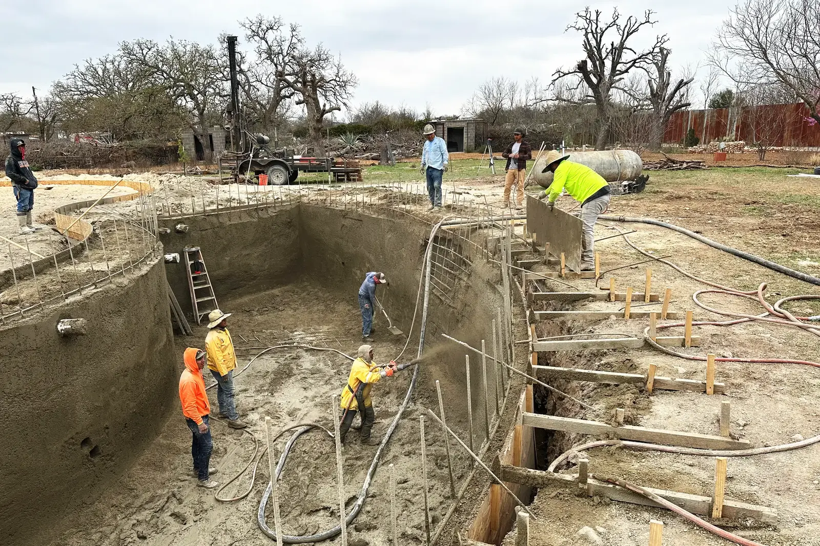 Workers Prep and Spray Shotcrete Workers Prep and Spray Shotcrete.