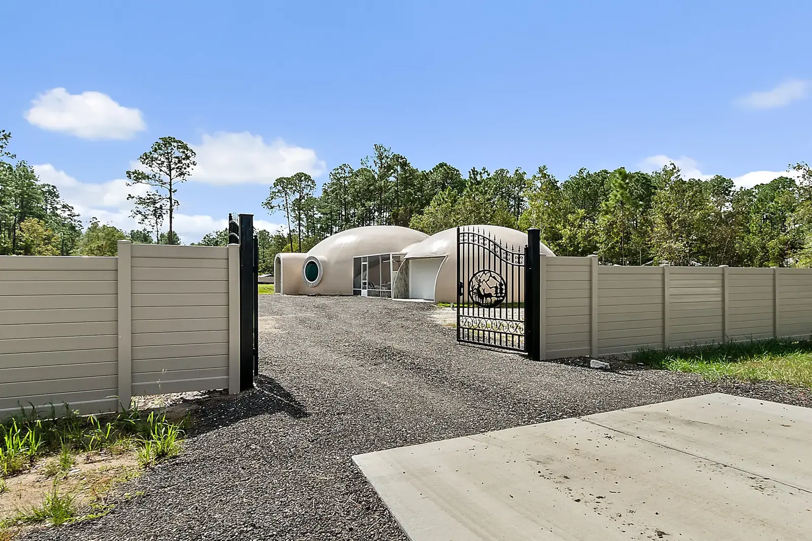 Monolithic Dome House Surrounded by Trees.