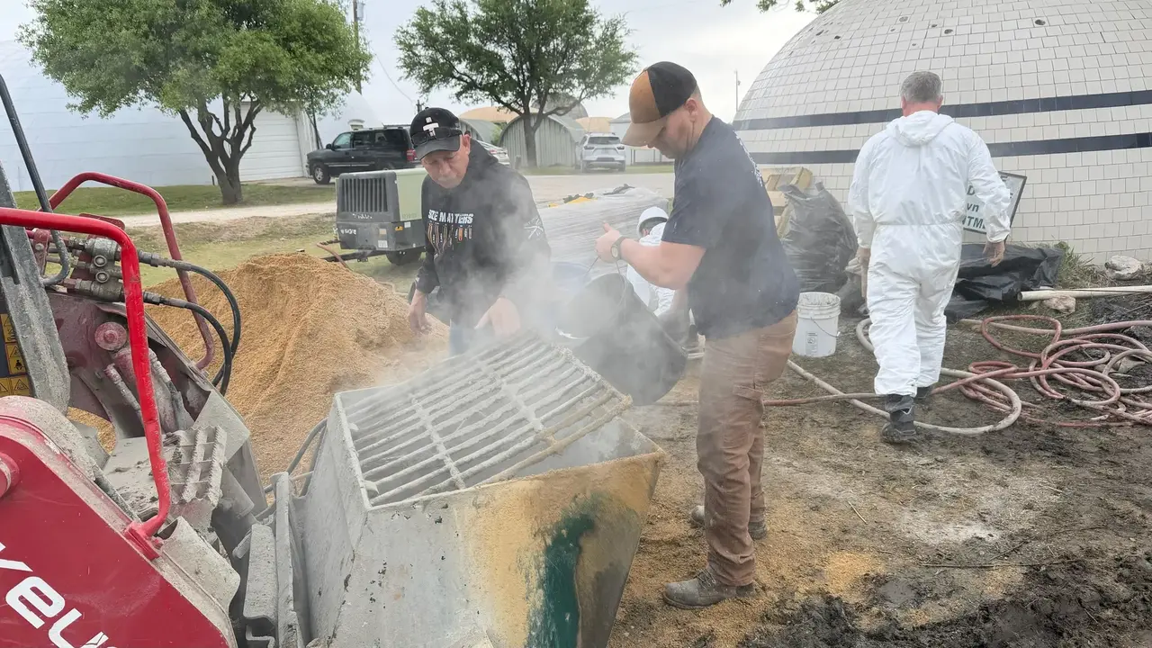 Students mixing concrete.